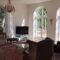 Beautiful french doors and arched windows in an ornate period living room