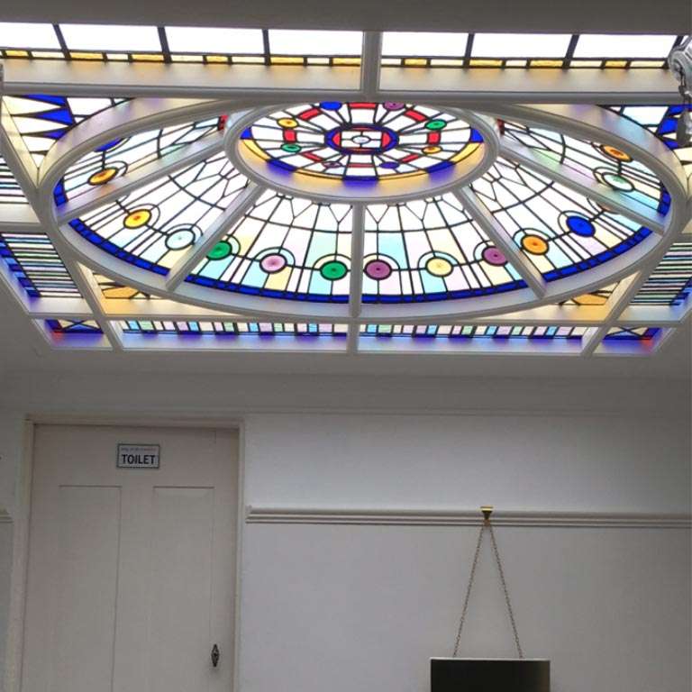 stained glass window in a dome stairway